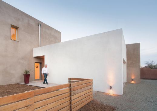 Doors and windows are trimmed in factory-finished fiber-cement board. The house hugs the property line, allowing for future expansion on the 50-foot-wide lot.