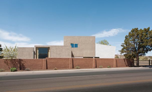 Designed to be attached or detached, the two-car garage sits to the left of the two-volume house and holds the solar equipment.