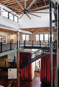 Interior finishes were kept to a minimum to reduce off-gassing of VOCs, and salvaged Douglas fir beams from the original building were reused as a decorative feature.
