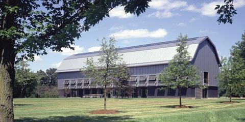 The naturally ventilated barn strikes a handsome pose in the rural Illinois landscape. 