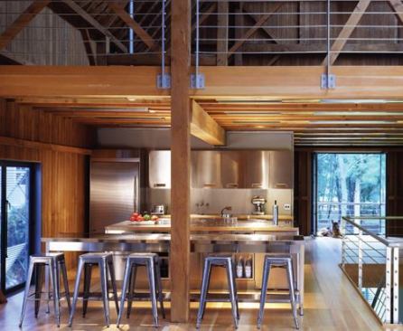 In accordance with Jahn's preference to keep the view of fixtures at a minimum, halogen spotlights are hidden within the beam structure of the kitchen ceiling.