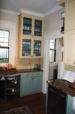 The original kitchen had one window and a small doorway to the pantry.