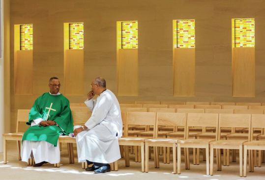 A moment of reflective discussion  inside the sanctuary.