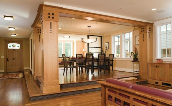 The elevated dining area is surrounded by columns and awash in natural light.