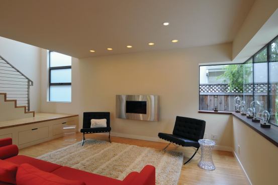 A ribbon of windows cantilevers slightly from the front of the house and features a no-mullion corner for a wraparound view.