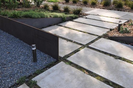 The original concete driveway was repurposed into front walkway pavers.