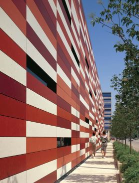 The building's exterior consists of 8-footlong, glass fiber-reinforced concrete panels that bring color to an otherwise drab street.