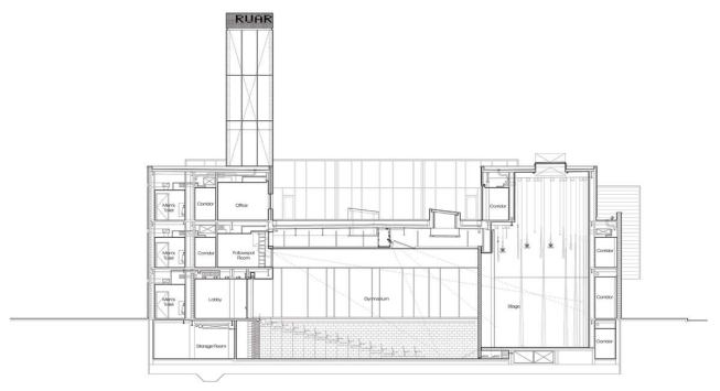 A section view shows how the center's many components embrace and form the gym/auditorium space that is the heart of the building.