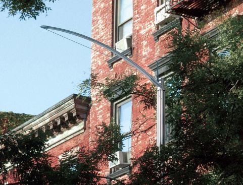 As opposed to a single lamp located at the end of the arm, a linear array of LED lamps will provide greater light coverage on the street.