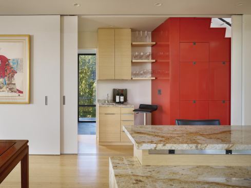 The stair compartment also holds a small bar area and access to the family room. 