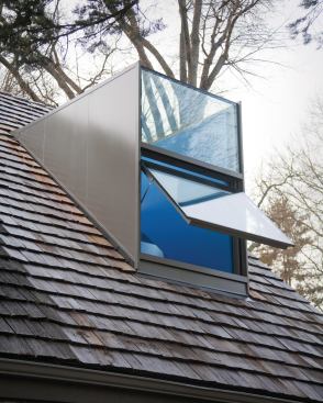 The dormer’s bottom section is an operable window.