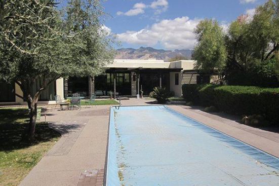 A before view of the house from poolside.