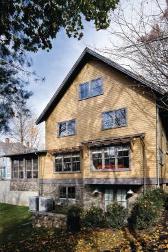 Locally sourced FSC-certified eastern white cedar shingles from Maibec, broad covered porches, and deep roof overhangs add to the home’s farmhouse look. DuPont Tyvek HomeWrap protects against wind and rain while sealing the home to help it stay dry, cool in the summer, and warm in the winter. Maibec: 800.363.1930. www.maibec.com/en. DuPont: 800.448.9835. www.dupont.com.