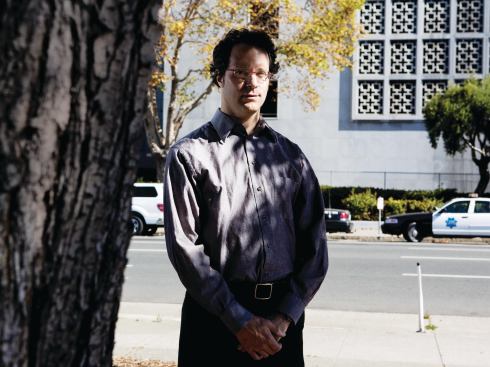 Raphael Sperry stands in front of San Francisco’s Hall of Justice, home to police headquarters, courtrooms, and a jail.