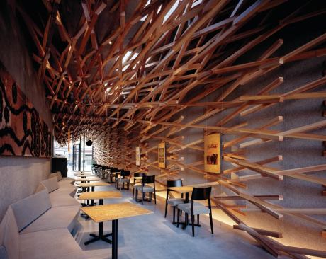 Inside, the café is dominated by a decidedly modern sculptural diagonal latticework of 2,000 cedar sticks.
