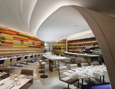 The project also features a curved bar and communal table. 








