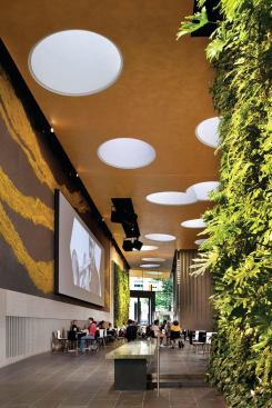 The atrium features a media wall. 