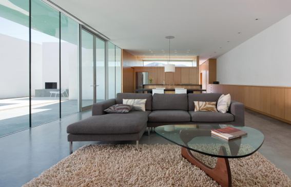 The main living space observes a visual boundary that includes the courtyard and pool.