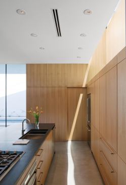 What appears to be a high window is, in fact, a periscope that projects a roof-top view of the Tucson Mountains onto a mirror mounted above the kitchen cabinets.