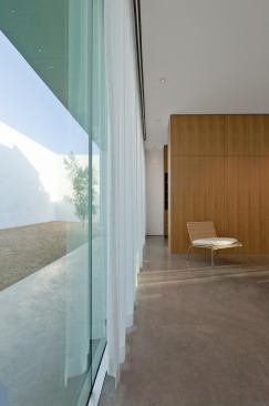 The master suite opens onto a more private rear courtyard.