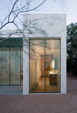 The master bath, with its windowed shower, relies on the garden wall for privacy.