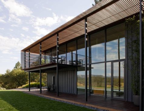 Ipe slats wrap the balcony as decking, screen, and awning. 

