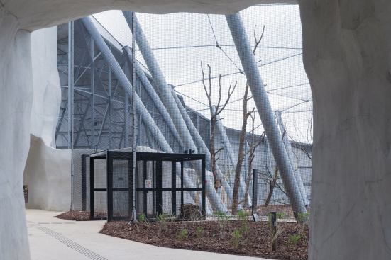 A much larger aviary tucked behind artificial rock anchors one corner of the park.
