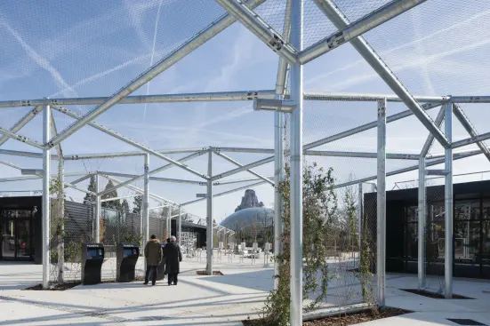 The main entrance to the zoo directs visitors between two new ticketing halls, and underneath a canopy of chain-link panels.